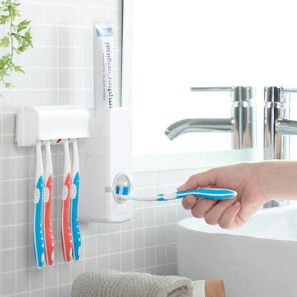 Toothpaste dispenser and toothbrush holder set