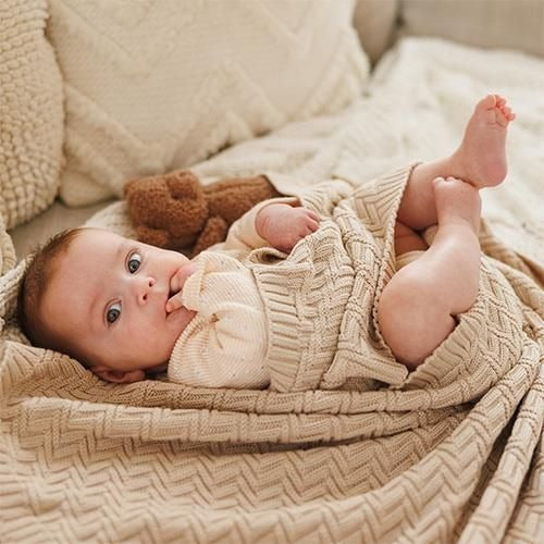 Beige knitted cotton blanket